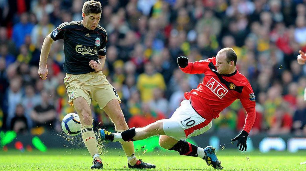 Wayne Rooney and Steven Gerrard in a challenge for the ball in a Premier League match in 2010
