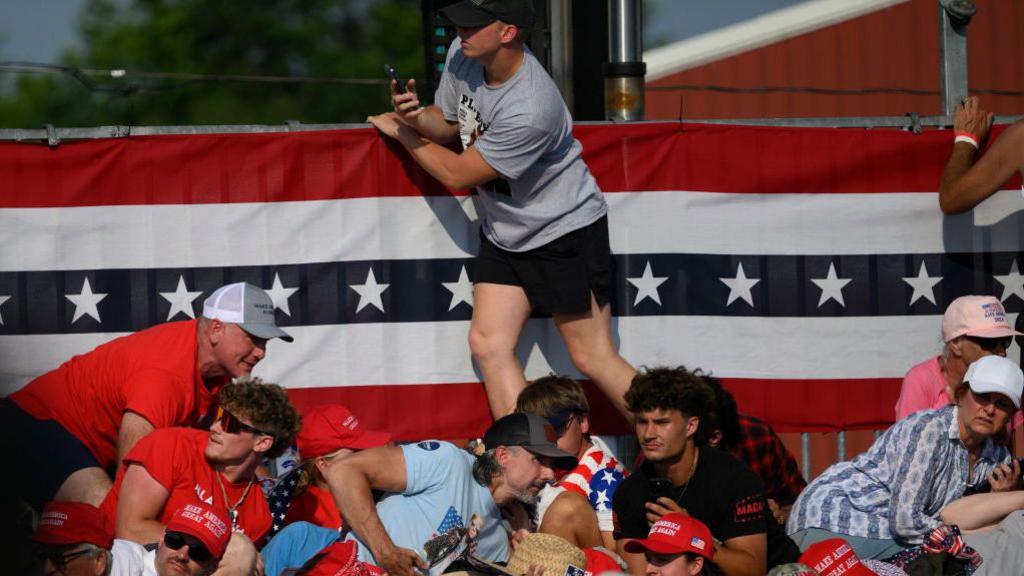 People taking cover during the rally in Butler PA