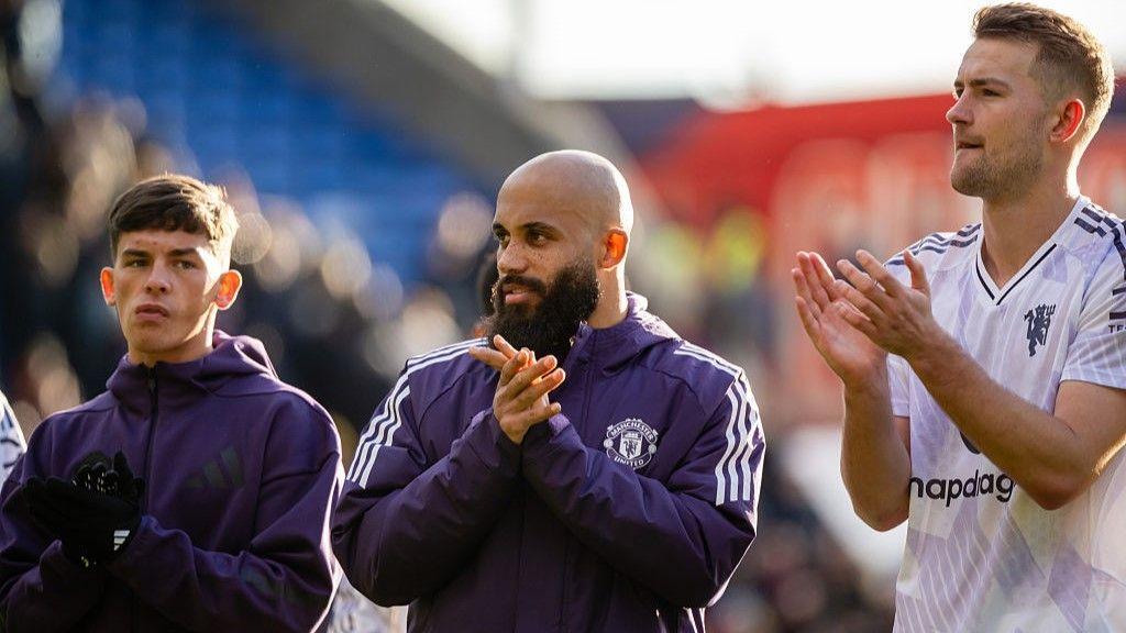 Manchester United youngster Shea Lacey (left) applauds fans after Sunday's win at Crystal Palace