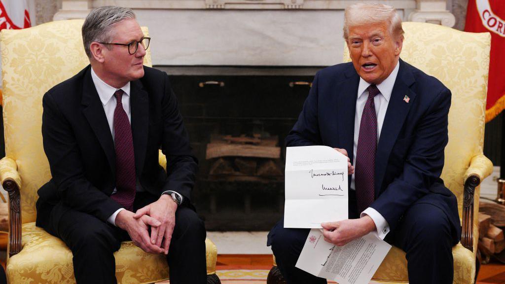 Kier Starmer and Donald Trump seen sitting on yellow armchairs in the US Oval Office, with Trump holding letter inviting him for the state visit