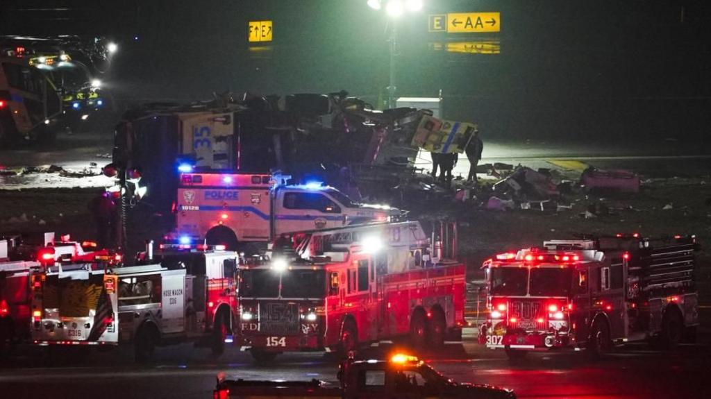 Emergency services at scene of a plane crash at New York's LaGuardia airport.