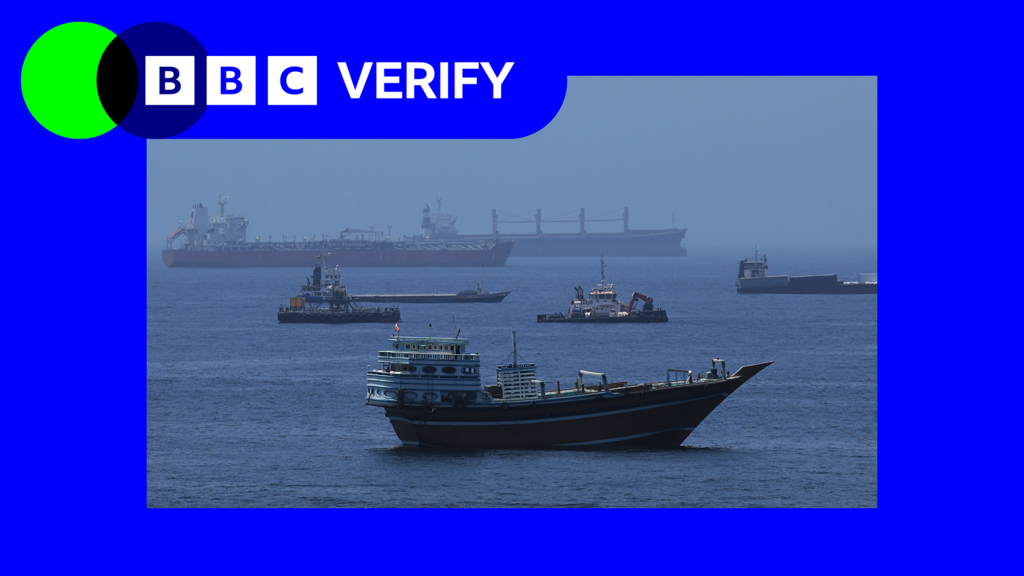 Cargo ships transiting the Strait of Hormuz as shipping resumes following the US-Iran ceasefire deal
