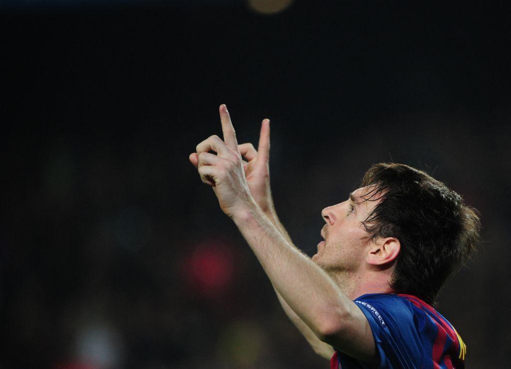 Messi celebrates by pointing to the sky.