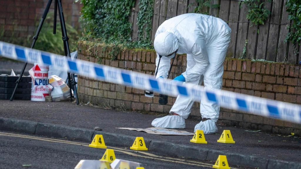 North Belfast, Northern Ireland. 9 June 2026. Police officers remain at the scene of a serious stabbing incident on Kinnaird Avenue in north Belfast. 