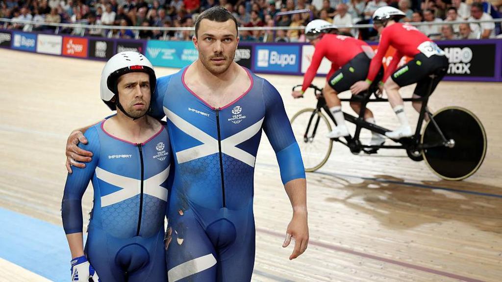 Scotland’s Neil Fachie and Aaron Pope walk away from a crash