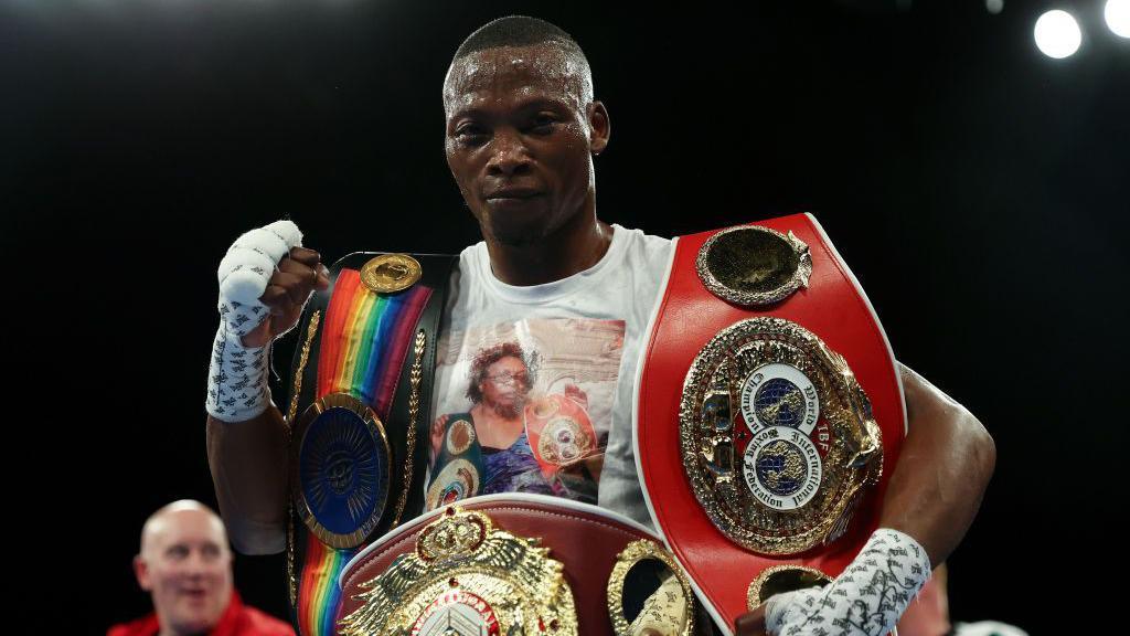 Zolani Tete with his world titles wraped around his waist and on his arms