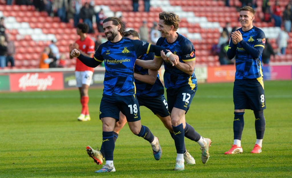 Doncaster Rovers players celebrate after beating Barnsley