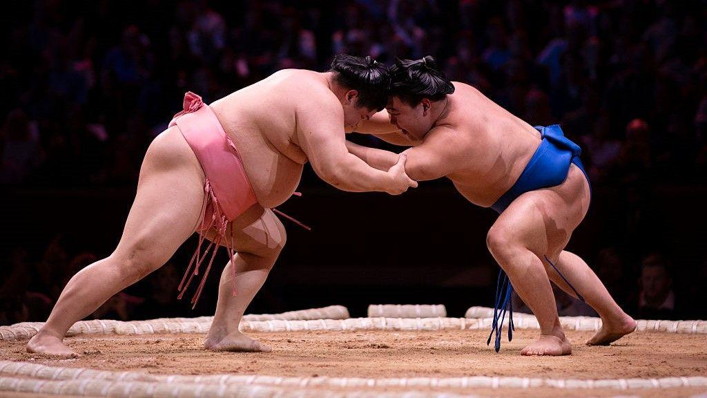 Ura and Fujinokawa wrestle during day two of The Grand Sumo Tournament at Royal Albert Hall 