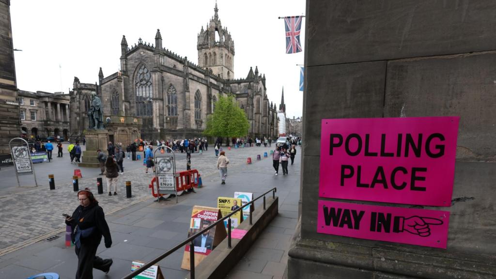 People walk past a polling station at Edinburgh City Chambers, in Edinburgh, Britain, 07 May 2026