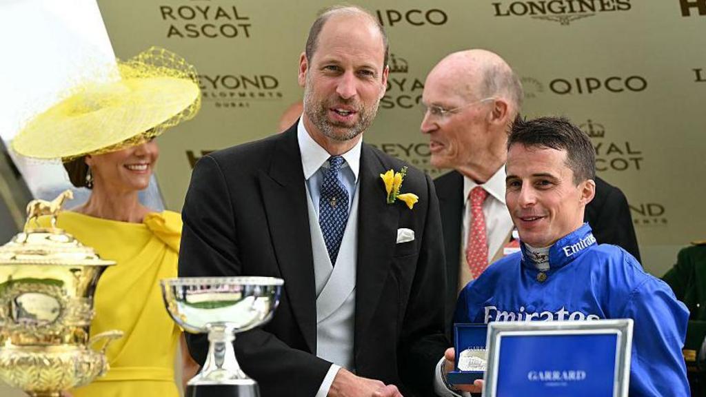 Prince William presents jockey William Buick with his award for riding Ombudsman to victory in the Prince Of Wales's Stakes on the second day of Royal Ascot in 2026