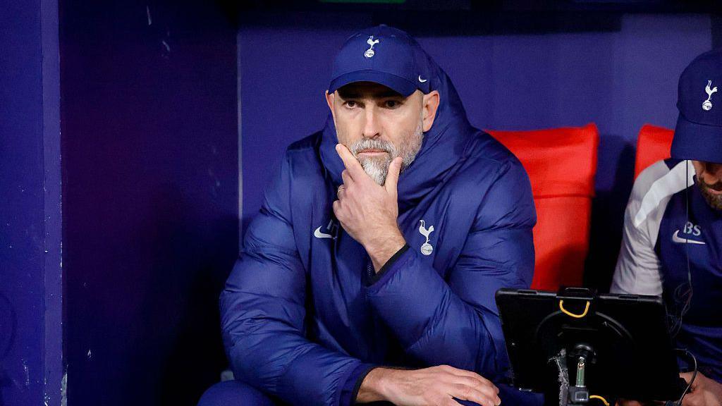 Igor Tudor holding his chin while sitting on the bench
