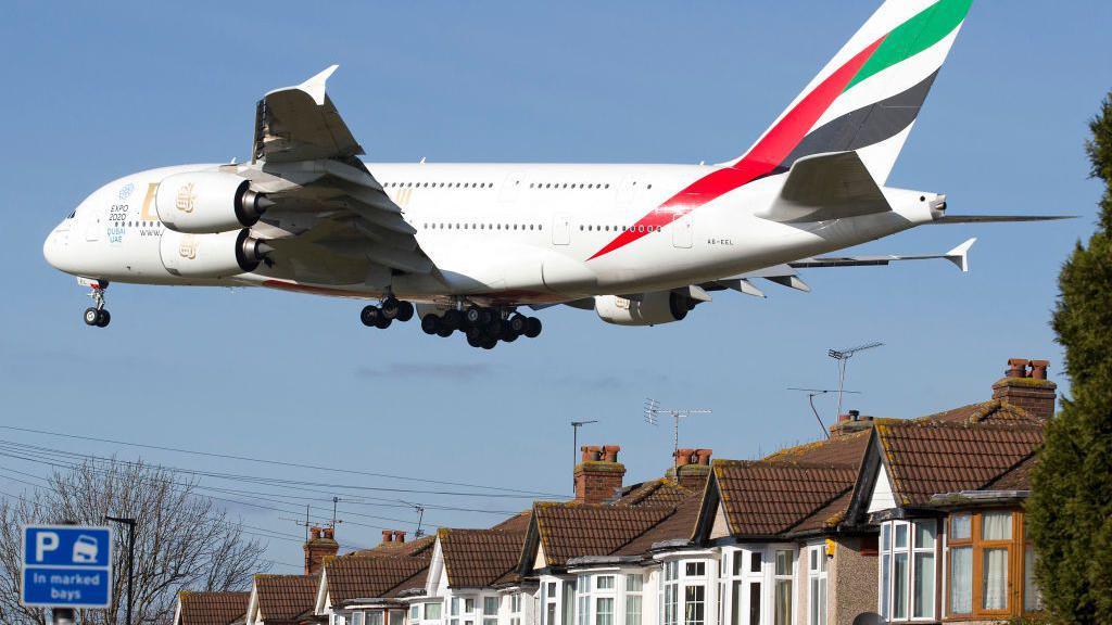 An Emirates Airbus A380 aircraft comes into lane at Heathrow Airport in west London on 18 February 2015