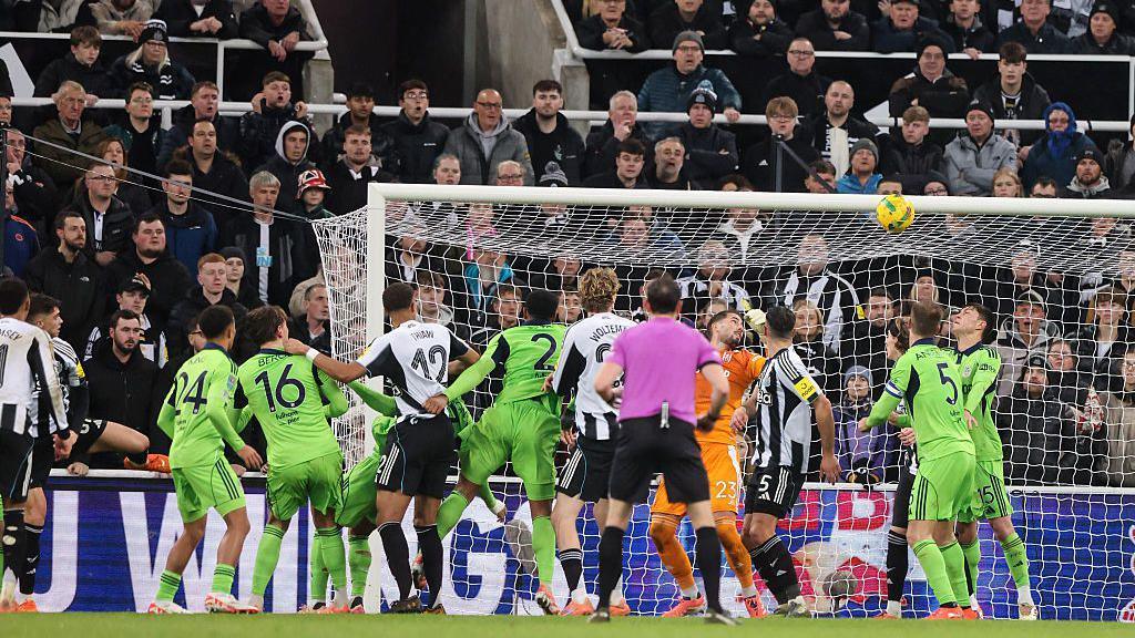 Newcastle United's Lewis Miley (2nd left) scores