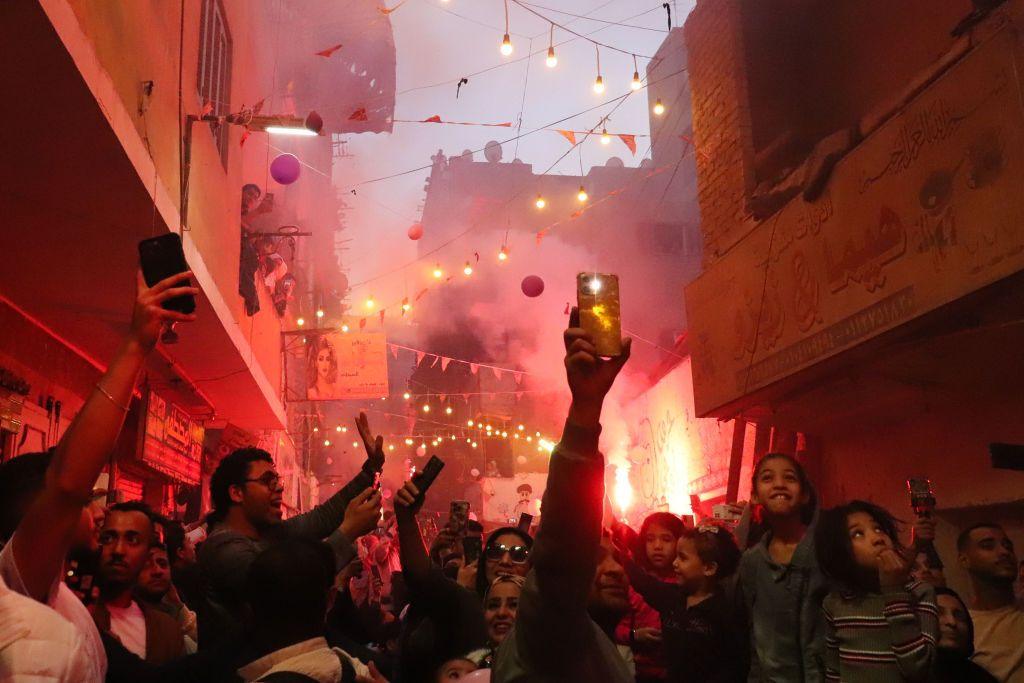 Celebrations take place after a communal iftar in the Matariya district of Cairo, Egypt. (Photo by Ahmed Mosaad/NurPhoto via Getty Images) 15 March