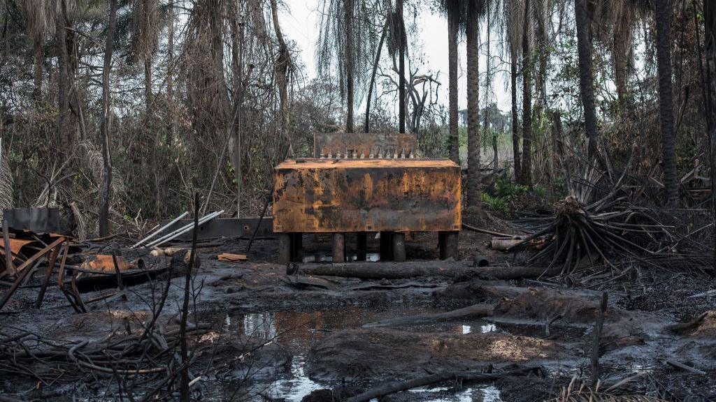 An illegal oil refinery destroyed by members of the Nigerian Navy forces is pictured on April 19, 2017 in the Niger Delta region near the city of Port Harcourt