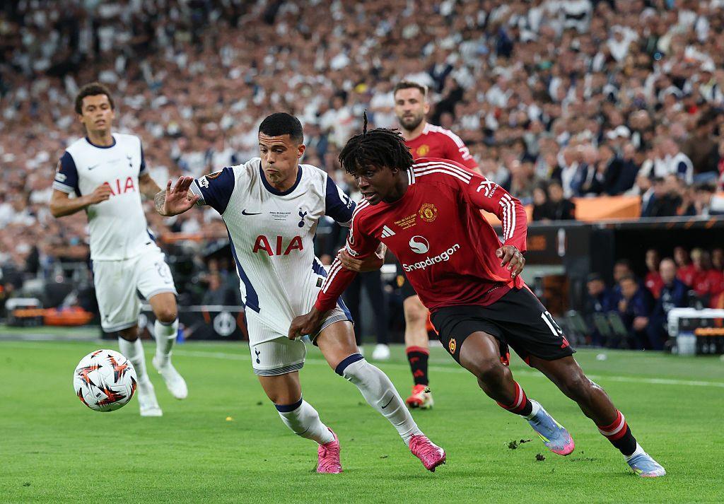 Pedro Porro and Patrick Dorgu competing for the ball during the Europa League final