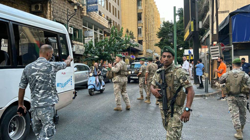 Military personnel direct traffic in Lebanon