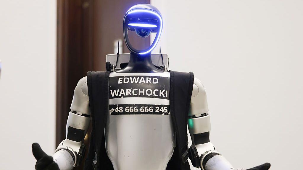 a robot with the name Edward Warchocki printed on the front.