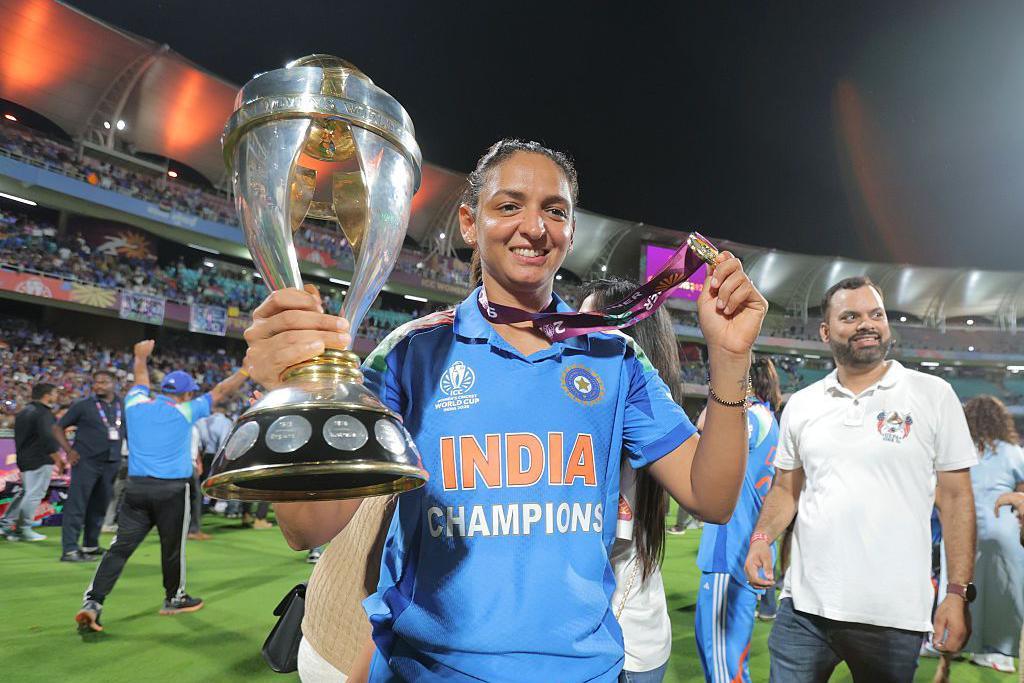 : Harmanpreet Kaur of India poses for a photograph with the ICC Women's Cricket World Cup trophy after her team's victory in the ICC Women's Cricket World Cup India 2025 Final match between India and South Africa at Dr. DY Patil Sports Academy on November 02, 2025 in Navi Mumbai, India. (Photo by Pankaj Nangia/Getty Images)