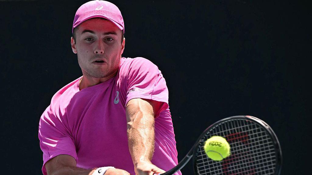 Arthur Fery plays a shot