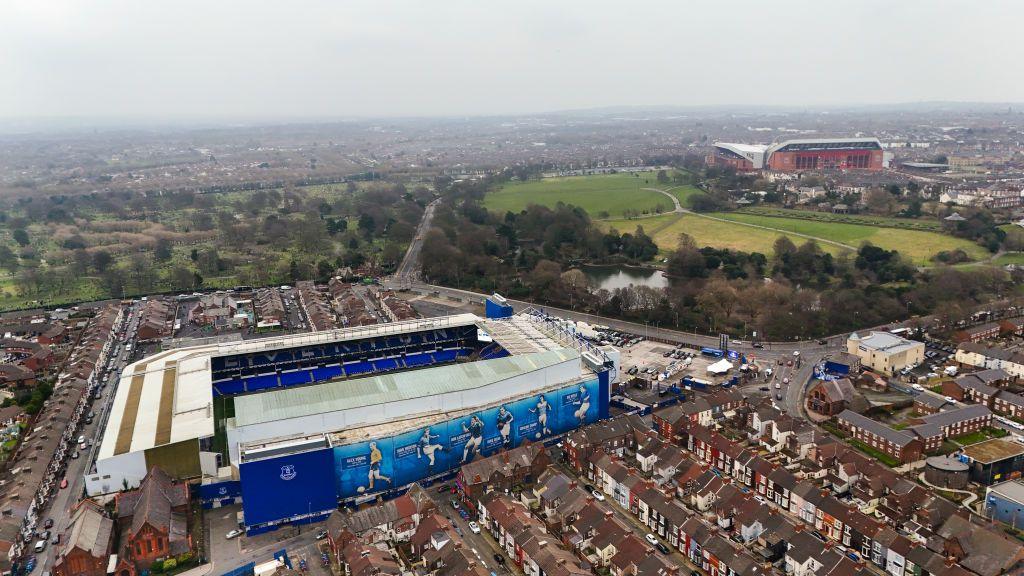 A general aerial view of Goodison Park seen in the foreground and Anfield seen in the background 