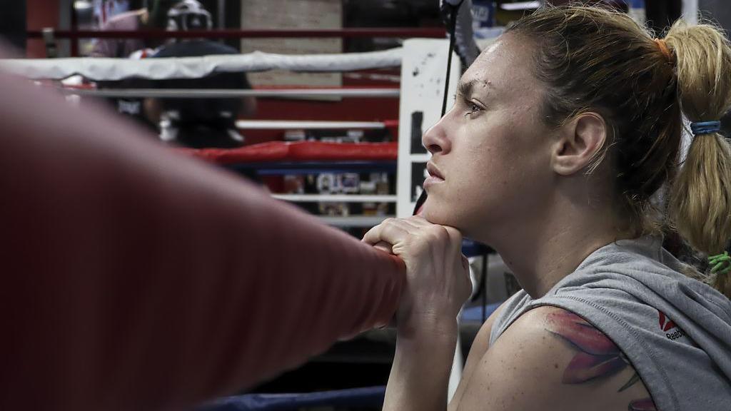 Heather Hardy holds nan statement connected a boxing ring