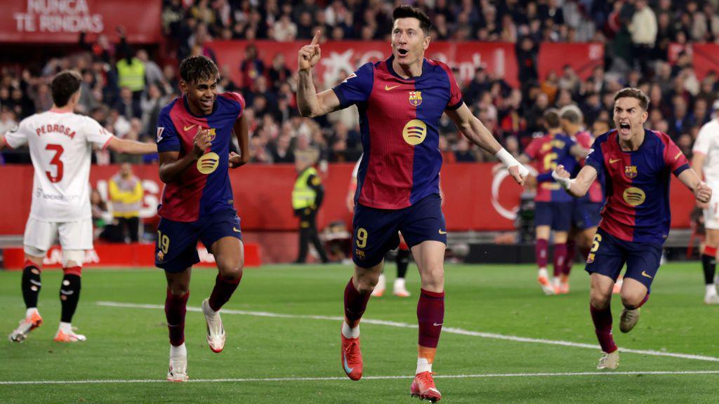 Robert Lewandowski celebrates scoring for Barcelona