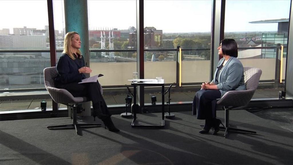 Laura Kuenssberg L and Shabana Mahmood R sitting down during interview indoors