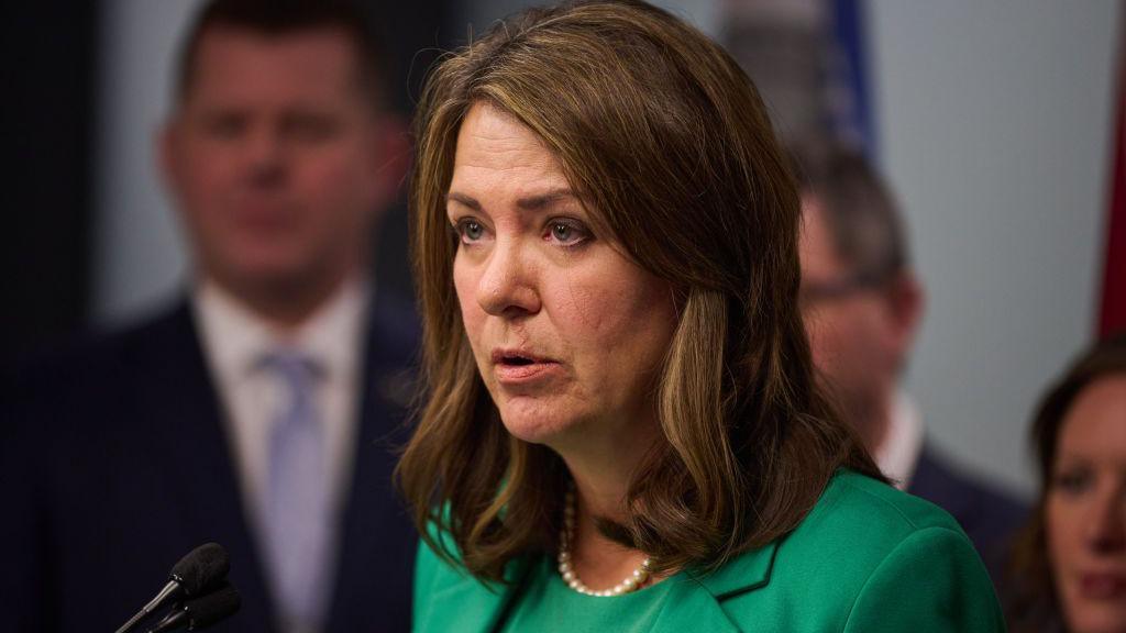 Danielle Smith, premier of Alberta, speaking at a podium