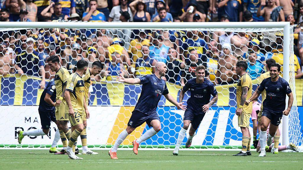Christian Gray celebrates after scoring for Auckland City.