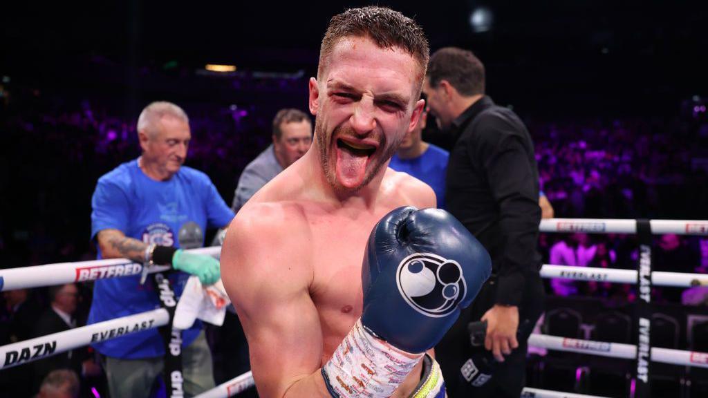 Reece Bellotti raises his glove and sticks out his tongue after beating Michael Gomez Jr in Manchester