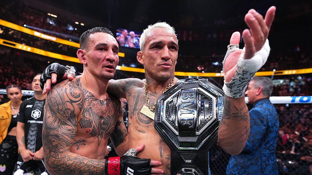 Charles Oliveira and Max Holloway after UFC 326