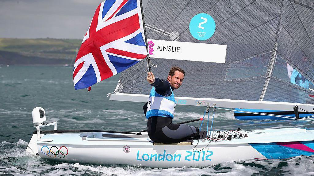 Ben Ainslie of Great Britain celebrates overall victory after competing in the Men's Finn Sailing Medal Race on Day 9 of the London 2012 Olympic Games at the Weymouth & Portland Venue at Weymouth Harbour on August 5, 2012 in Weymouth, England.