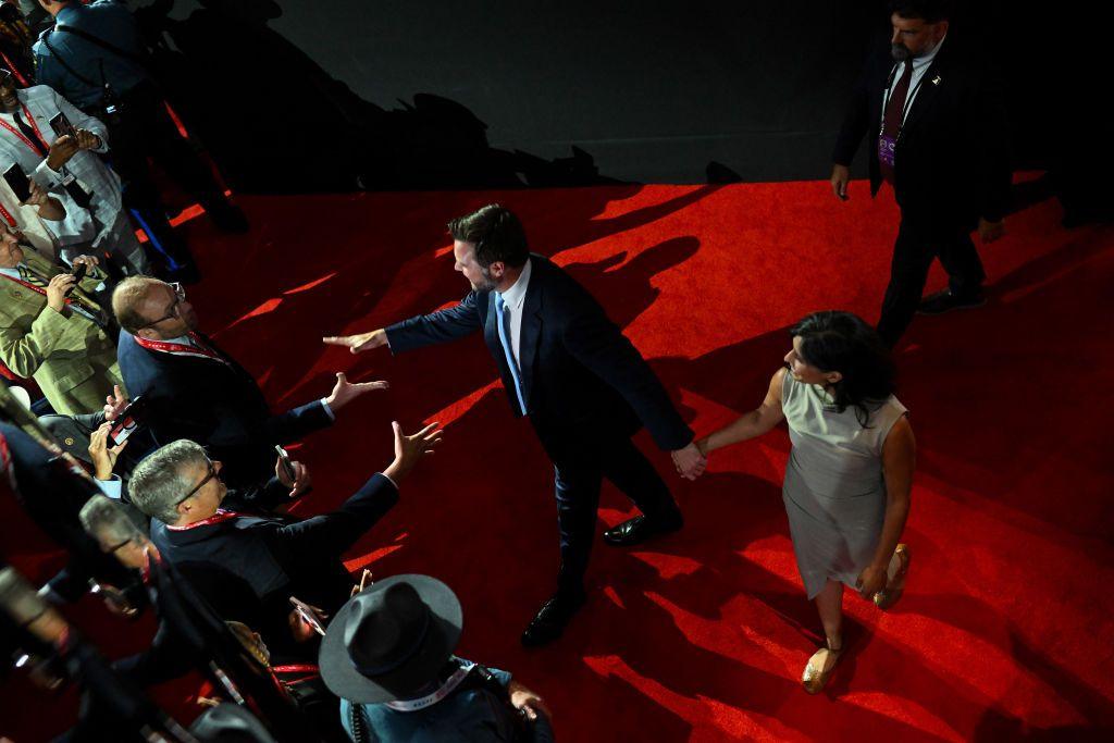 Overhead shot of reporters trying to speak to JD and Usha Vance on red carpet