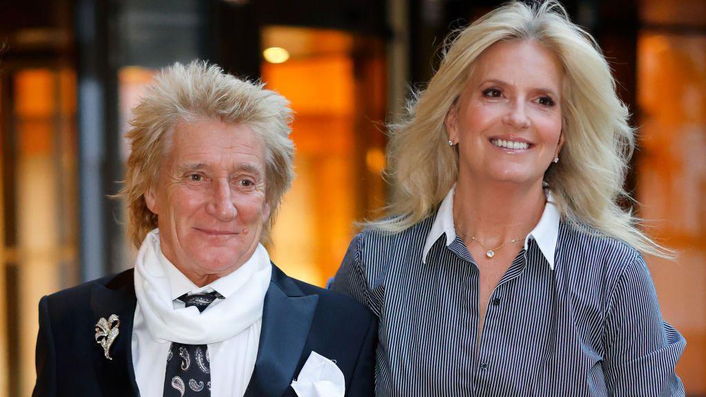 Penny Lancaster pictured with her husband, Sir Rod Stewart. Both are smiling as they attend the WellChild Awards 2024 at the Royal Lancaster Hotel 