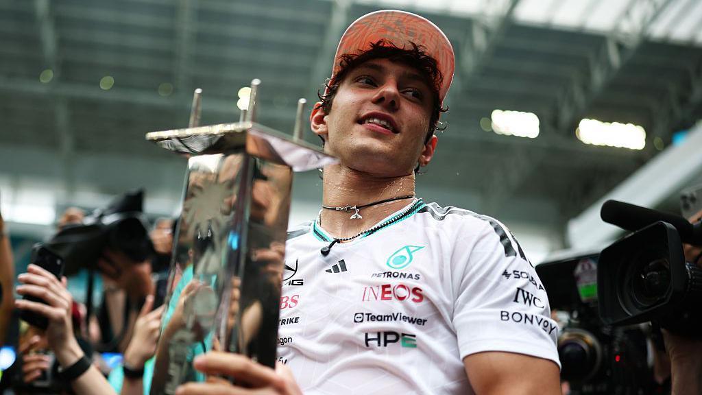 Kimi Antonelli holds his winner's trophy in Miami 