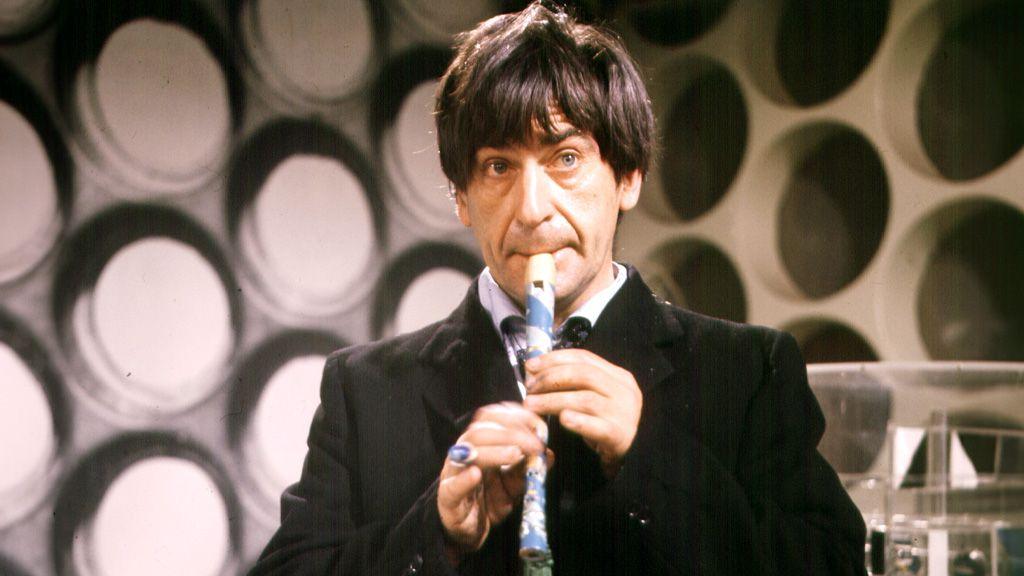 Patrick Troughton as Doctor Who playing a recorder in the TARDIS console room