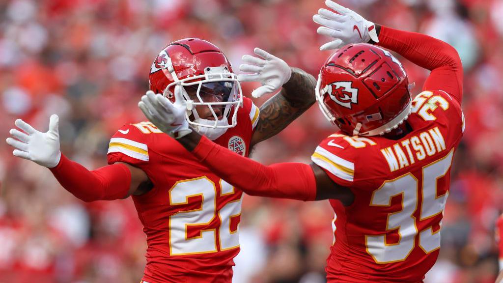 Trent McDuffie and Jaylen Watson pictured waving their hands playing for the Kansas City Chiefs before they both joined the Los Angeles Rams