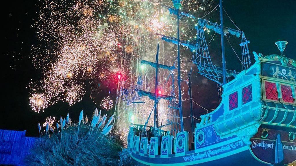 Firework display behind Southport Pleasureland Pirate Ship