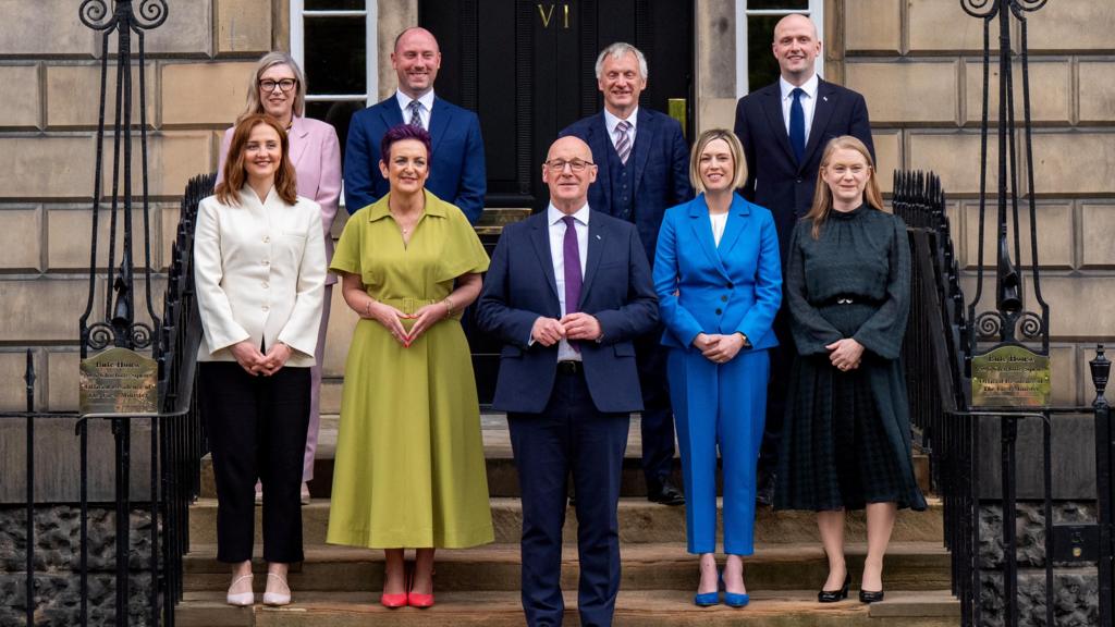 John Swinney and his cabinet stand on the steps of Bute House
