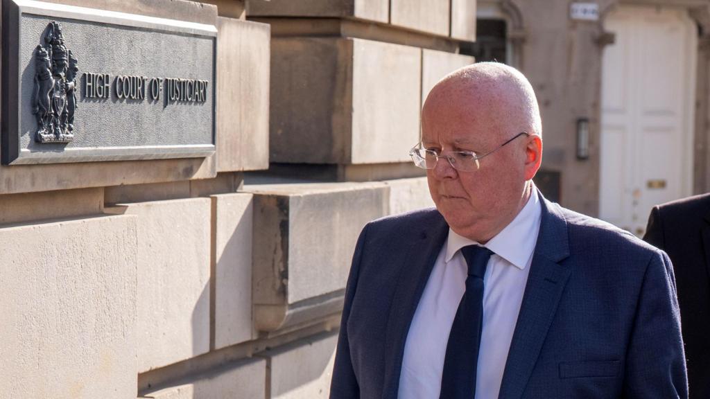 peter murrell walking into court