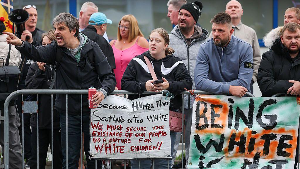 Anti-migrant protesters demonstrate outside the Cladhan Hotel in Falkirk on 7 September.