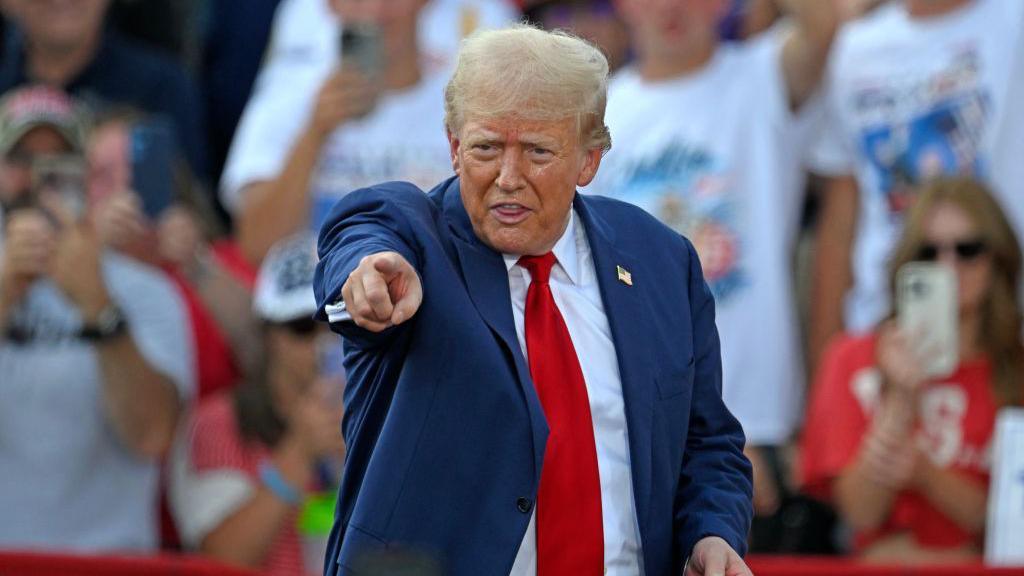 Republican presidential candidate Donald Trump gestures during a campaign rally in North Carolina on 21 August