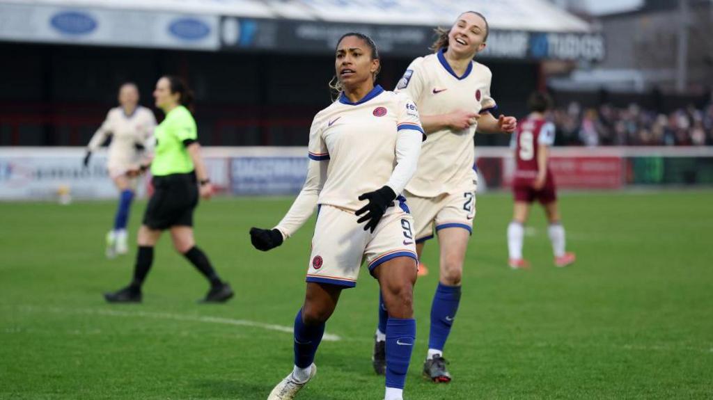 Catarina Macario celebrates after scoring