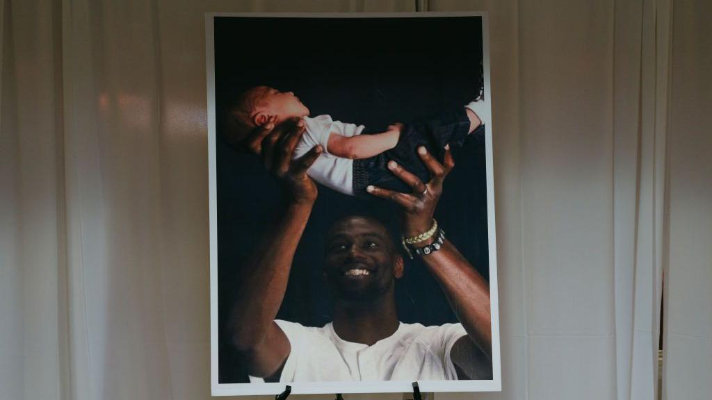 A photograph used at Tyre Nichols's funeral that showed him holding his child 