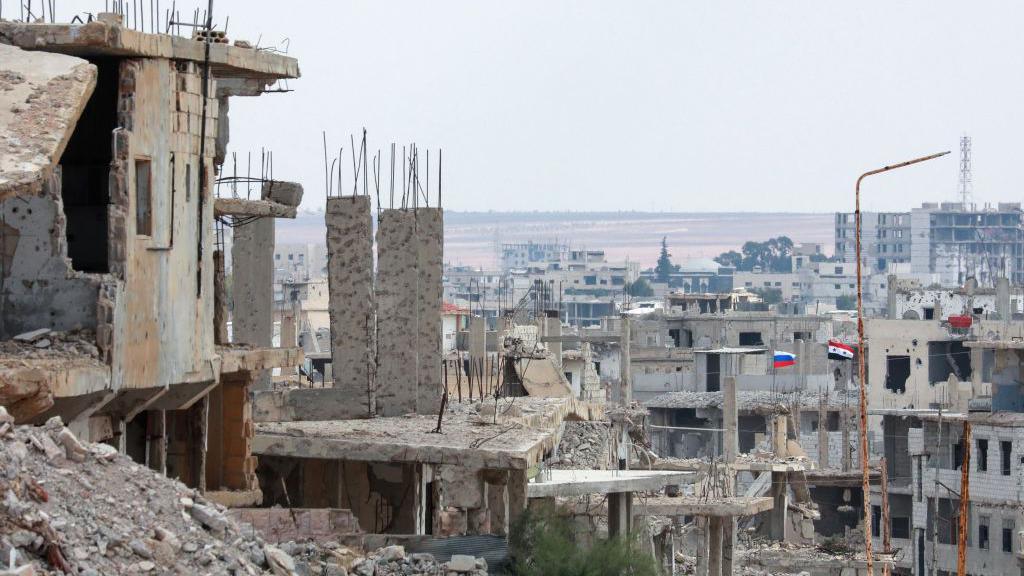 Damaged buildings in the city of Deraa