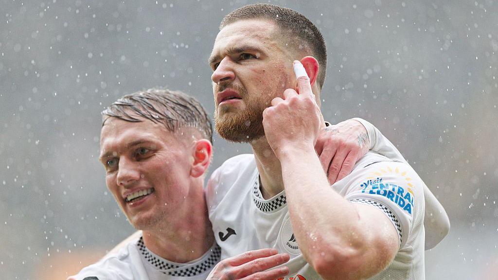 Ethan Galbraith celebrates with Zan Vipotnik