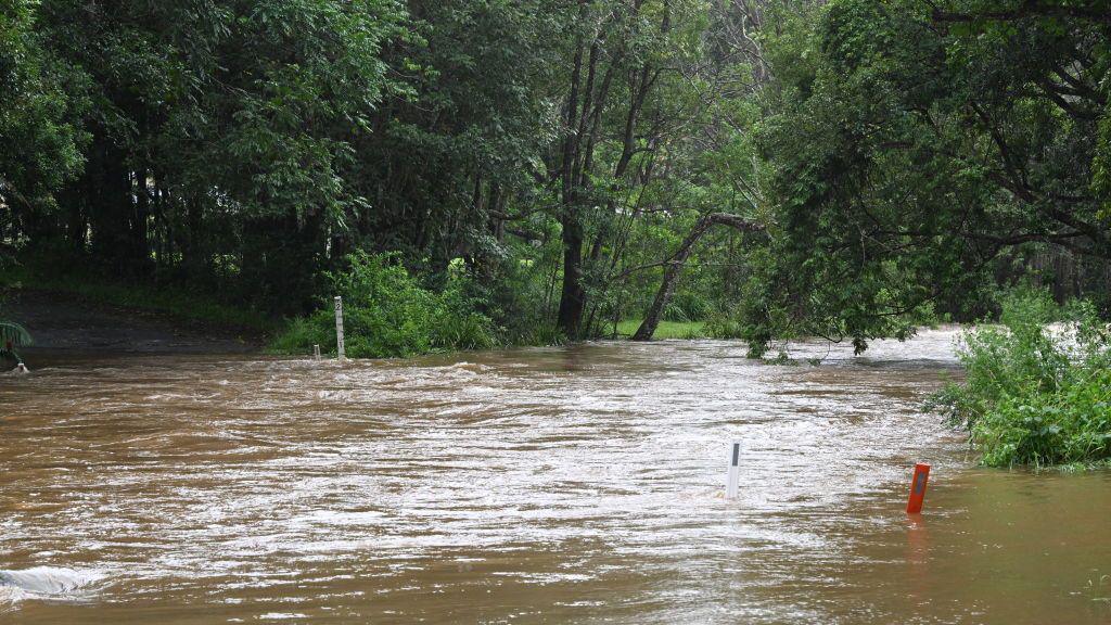 A flooded causeway in heavy rain in Tintenbar, Australia.