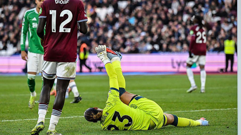 Image of West Ham keeper Alphonse Areola down with cramp in their recent match against Newcastle
