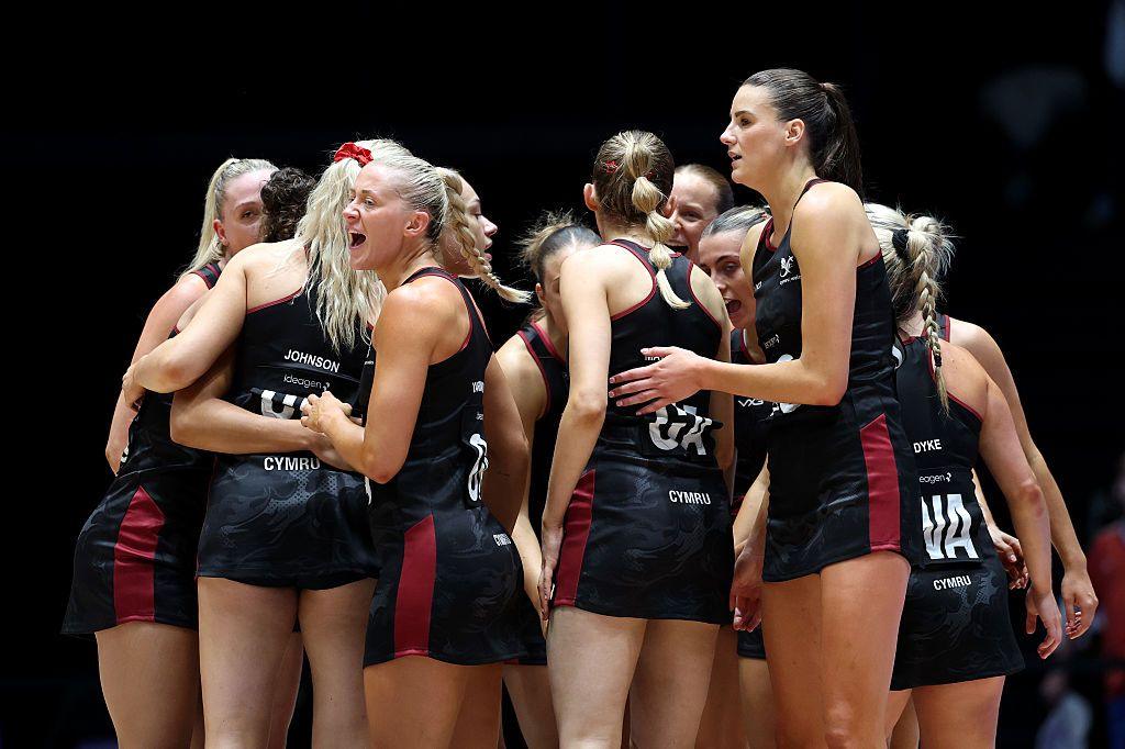 Wales netball players in a huddle